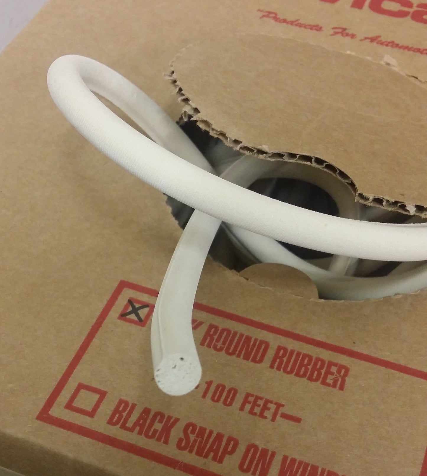 100ft 3/8" white round rubber cord in cardboard box