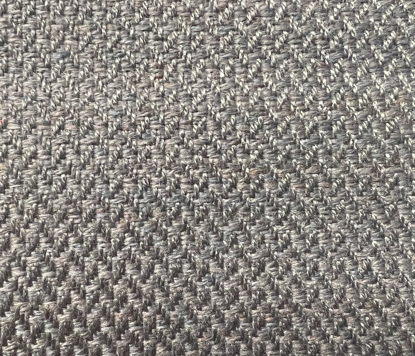 535 Wellington Lt. Graphite fabric swatch: close-up of textured, dark grey herringbone weave.