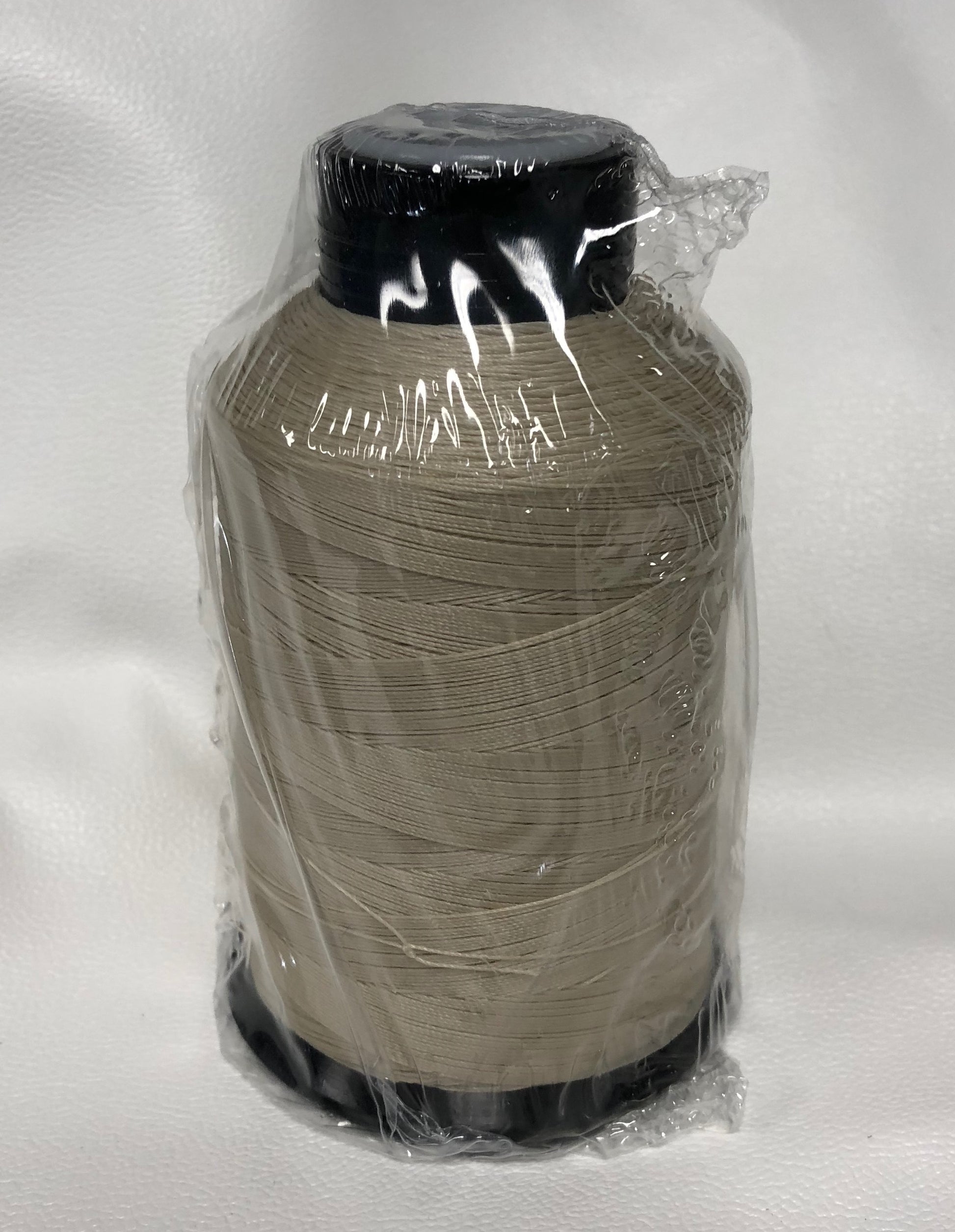 Sunguard B92 Parchment 239Q 4oz thread spool, light beige, plastic wrapped.