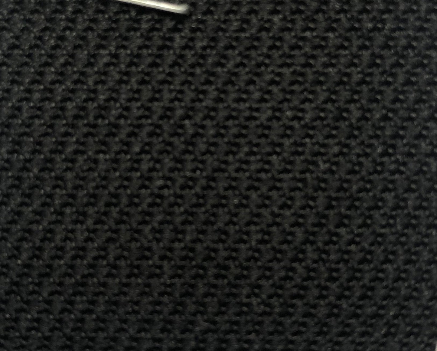 1729 Flint Jet Black fabric swatch: close-up of textured, dark gray nylon.