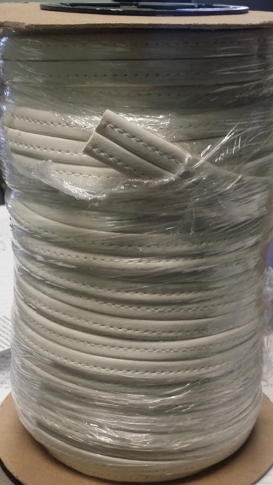 Off-white Hidem Welt 25yd: 25 yards of off-white leather welt cord ideal for upholstery and crafts.