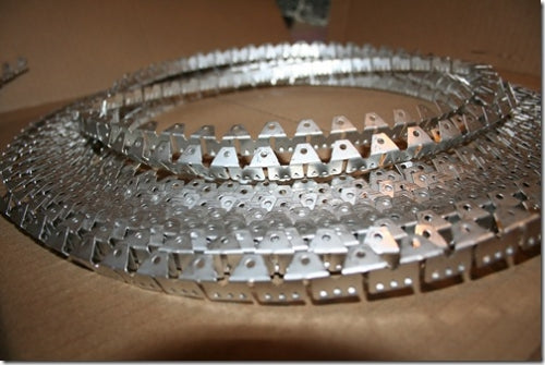 Curve ease Medium: silver metal strips with small holes, ideal for crafting projects.