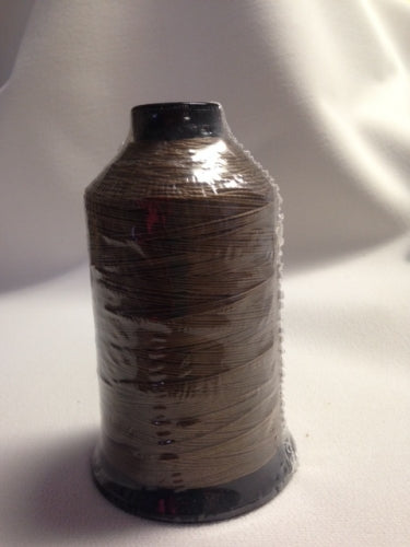 T-270 Nylon 717Q saddle contrast thread spool, brown, plastic-wrapped.