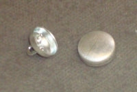 Silver 22-wire eye buttons, 9/16" cap size, for sewing and crafting projects.