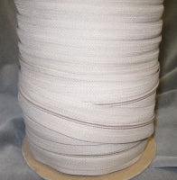 Beige nylon coil zipper, 4.5 size, bulk spool for apparel and crafts.
