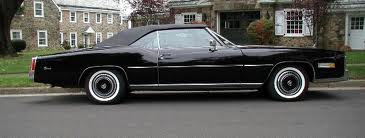 Black 1971-1976 Cadillac Eldorado convertible, HT 129 EZ ON, tinted glass.