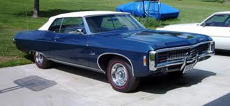 1969-1970 Chevrolet Impala Convertible, dark blue with white top.