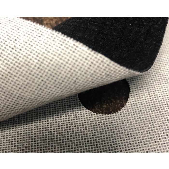 Close-up of black velour flock fabric showing texture and backing.