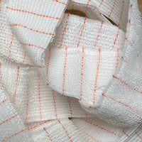 Soft Seat Loop, 25-yard roll of white mesh with orange grid lines.