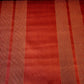 Red upholstery fabric sample with subtle gold vertical stripes.