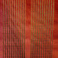 Detroit #6435 Cavalier Red upholstery fabric: rich red with gold and brown stitching detail.