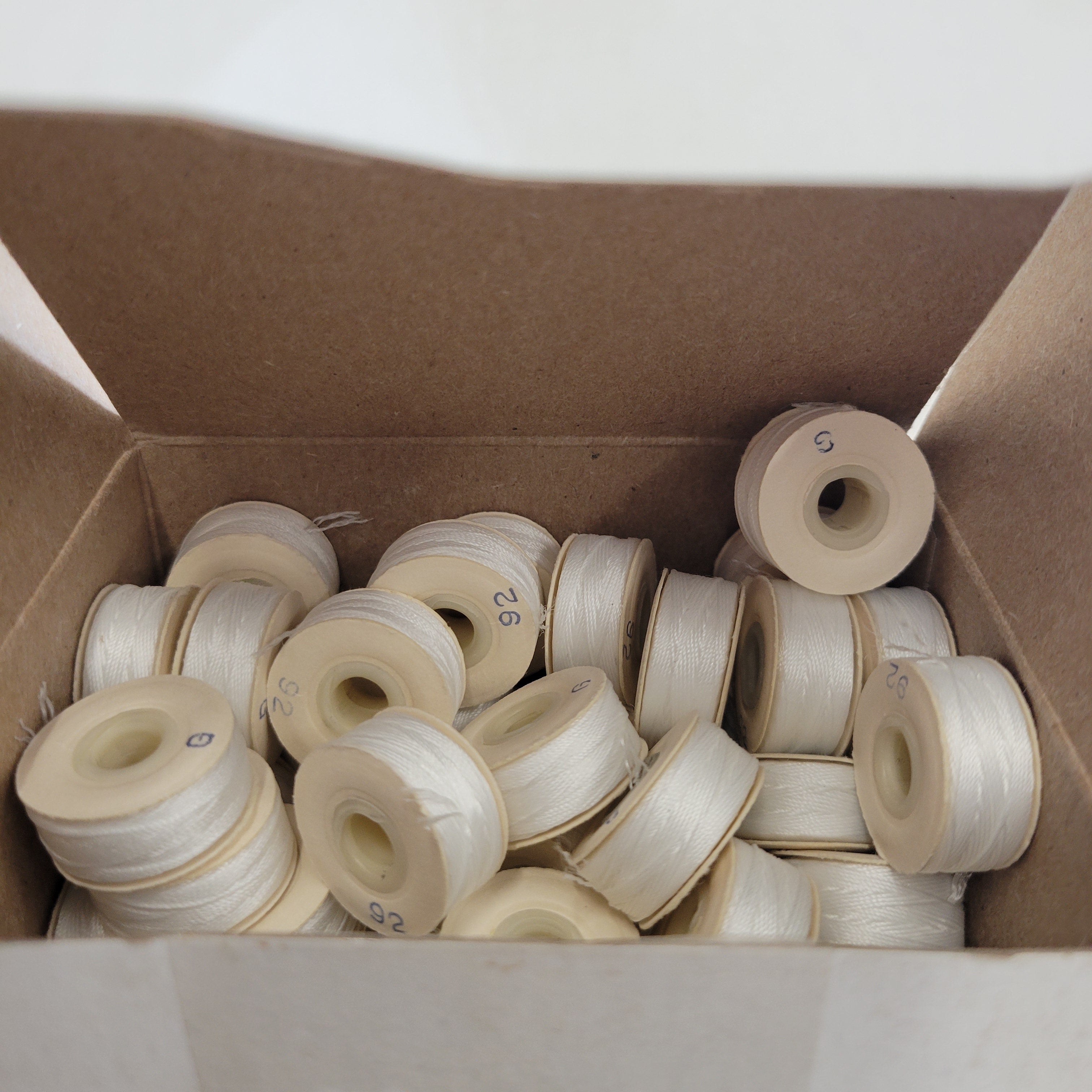 201q Sunguard 92G Natural White Bobbins 201Q | Upholstery Supplies | Midwest ...