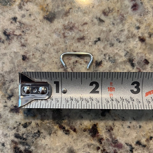 5 lb. hog rings, 1 inch size, shown next to measuring tape
