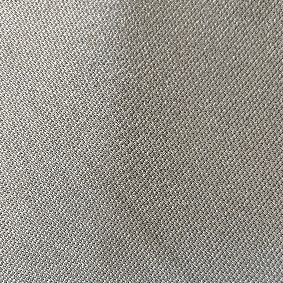 Close-up view of light gray fabric with a subtle textured weave.
